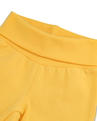 Yellow trousers, foldable stretch fabric at the waist.