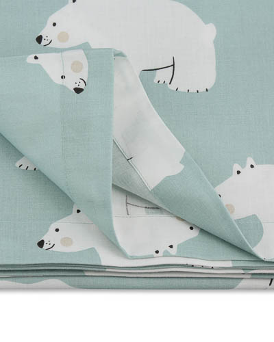 Turquoise duvet cover with polar bear pattern.
