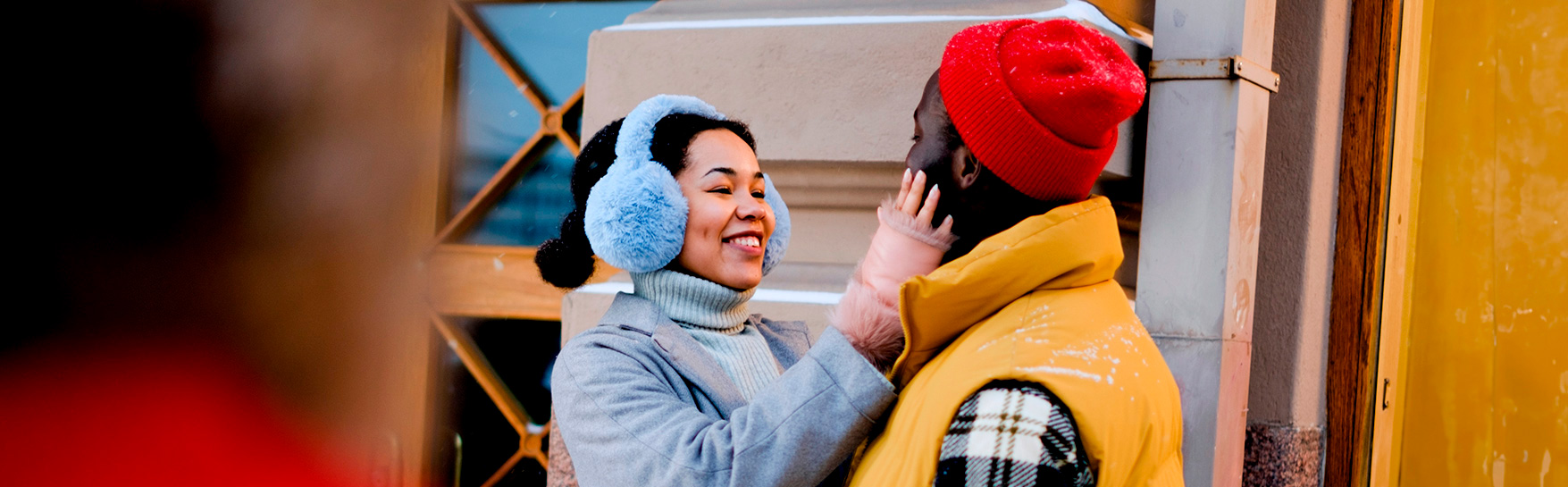 Two people outside hugging.