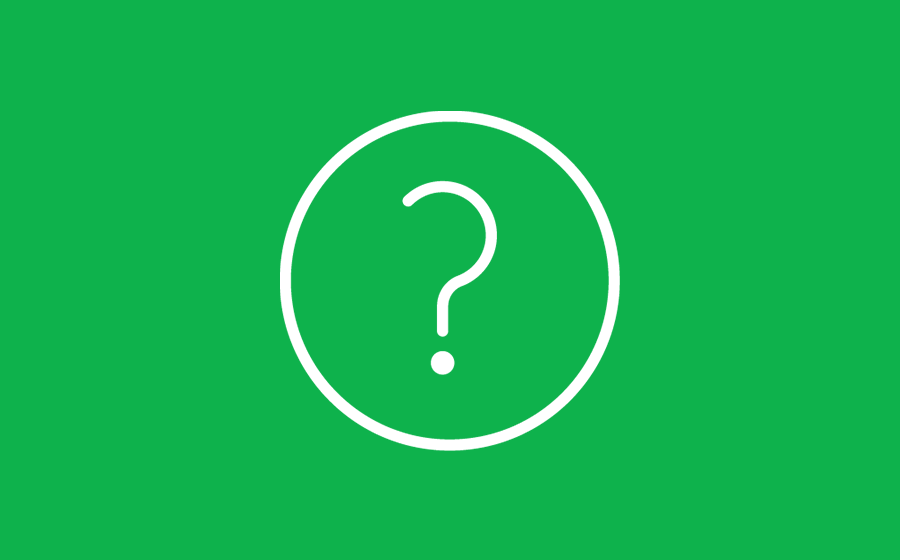 Question mark icon inside a circle on a green surface.